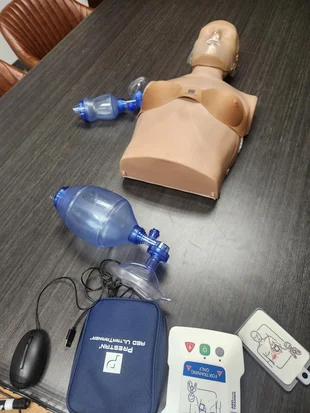 CPR training mannequin and equipment ready for class